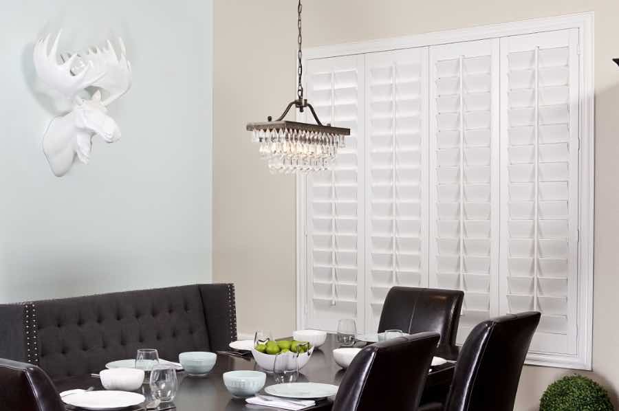 Closed Polywood shutters on a dining room window